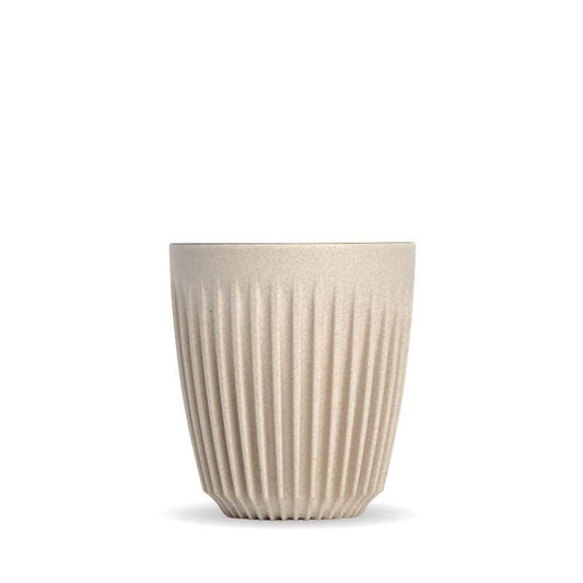 8oz Natural Huskee reusable coffee cup|Pack of 4, 8oz Natural Huskee reusable coffee cups stacked in front of packaging box