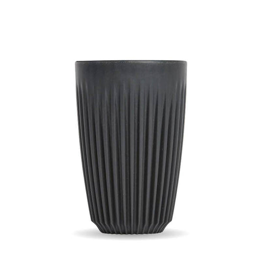 2oz Charcoal Huskee reusable coffee cup|Pack of 4, 12oz Charcoal Huskee reusable coffee cups stacked in front of packaging box