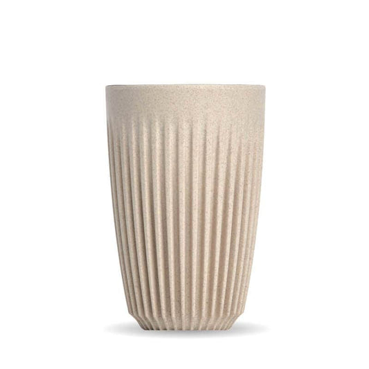 12oz Natural Huskee reusable coffee cup|Pack of 4, 12oz Natural Huskee reusable coffee cups stacked in front of packaging box