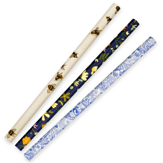 Three pieces 10mm Jumbo Art Series BioStraw in flower and bee design|Assorted BioPak art series paper straws on wooden table|10mm Jumbo Art Series BioStraw Line Drawing